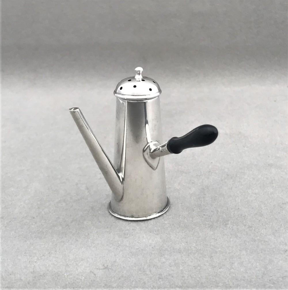 A charming novelty silver chocolate pot pepperette