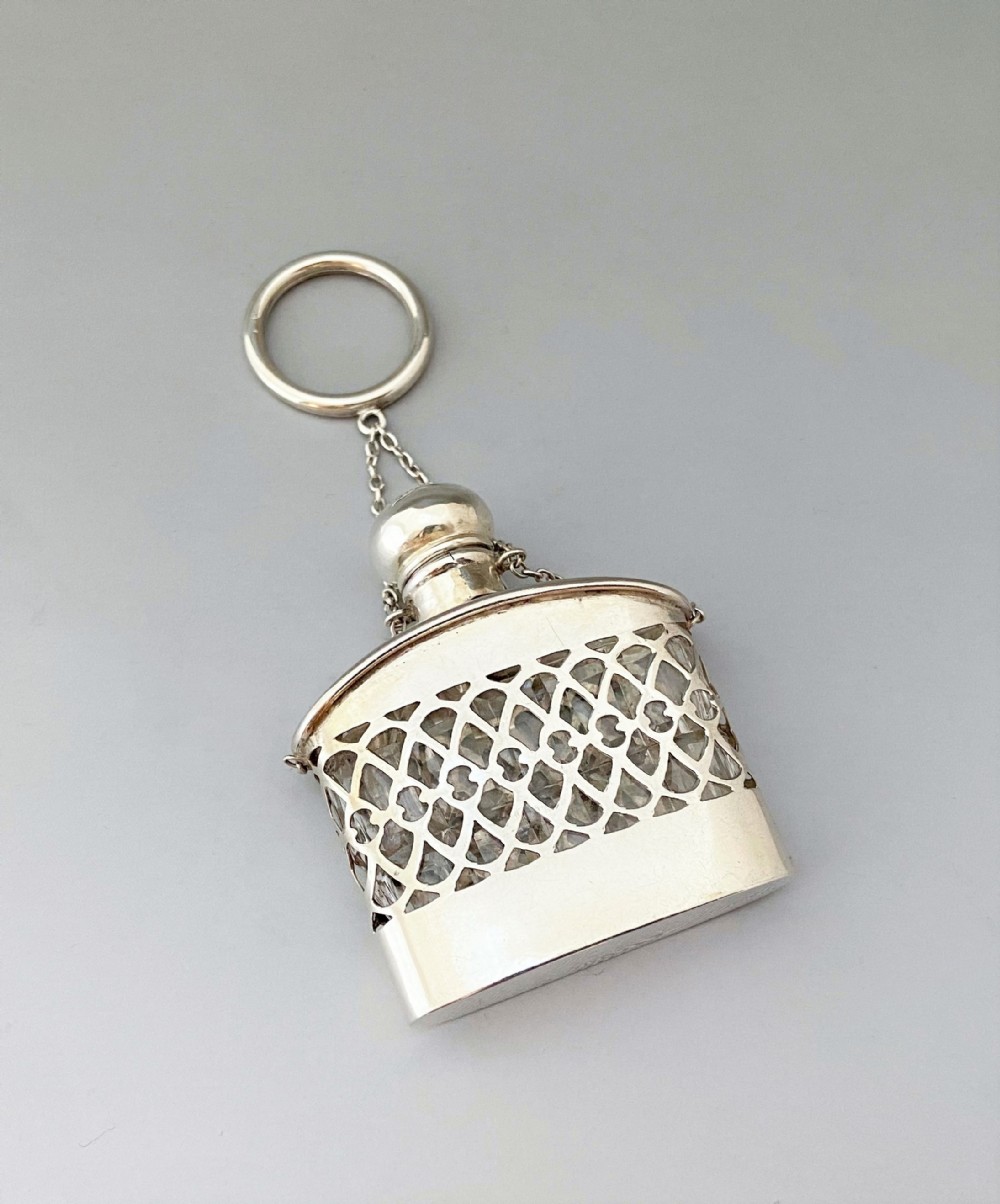 A gorgeous silver cased, cut glass scent bottle
