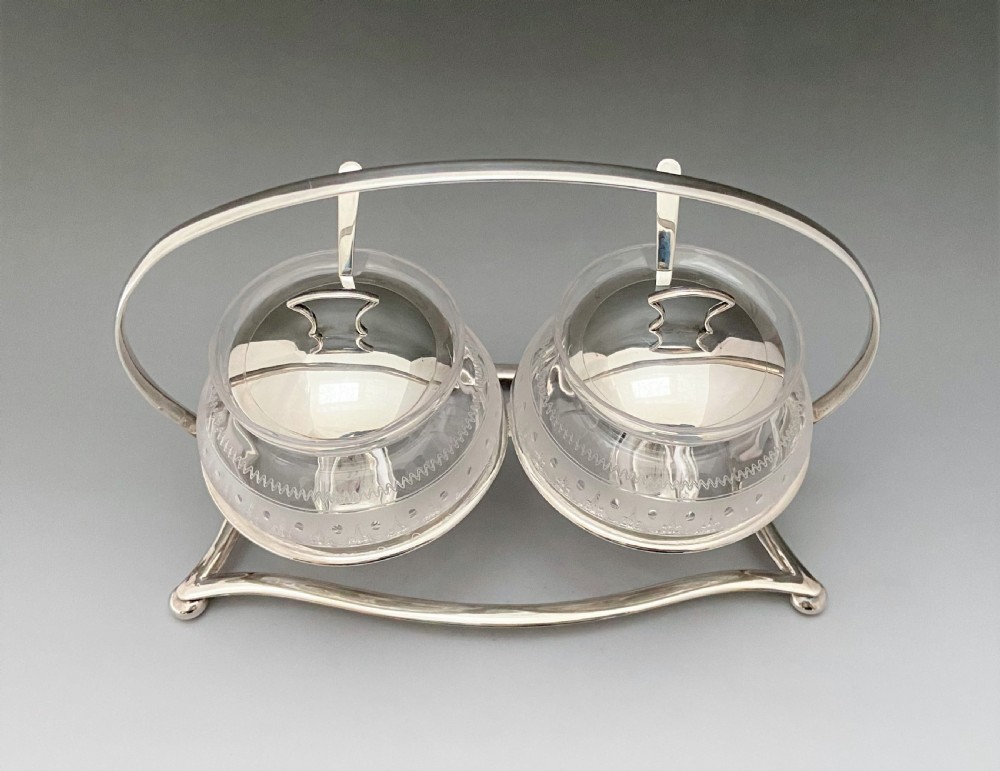 A fabulous silver plated double preserve stand View II