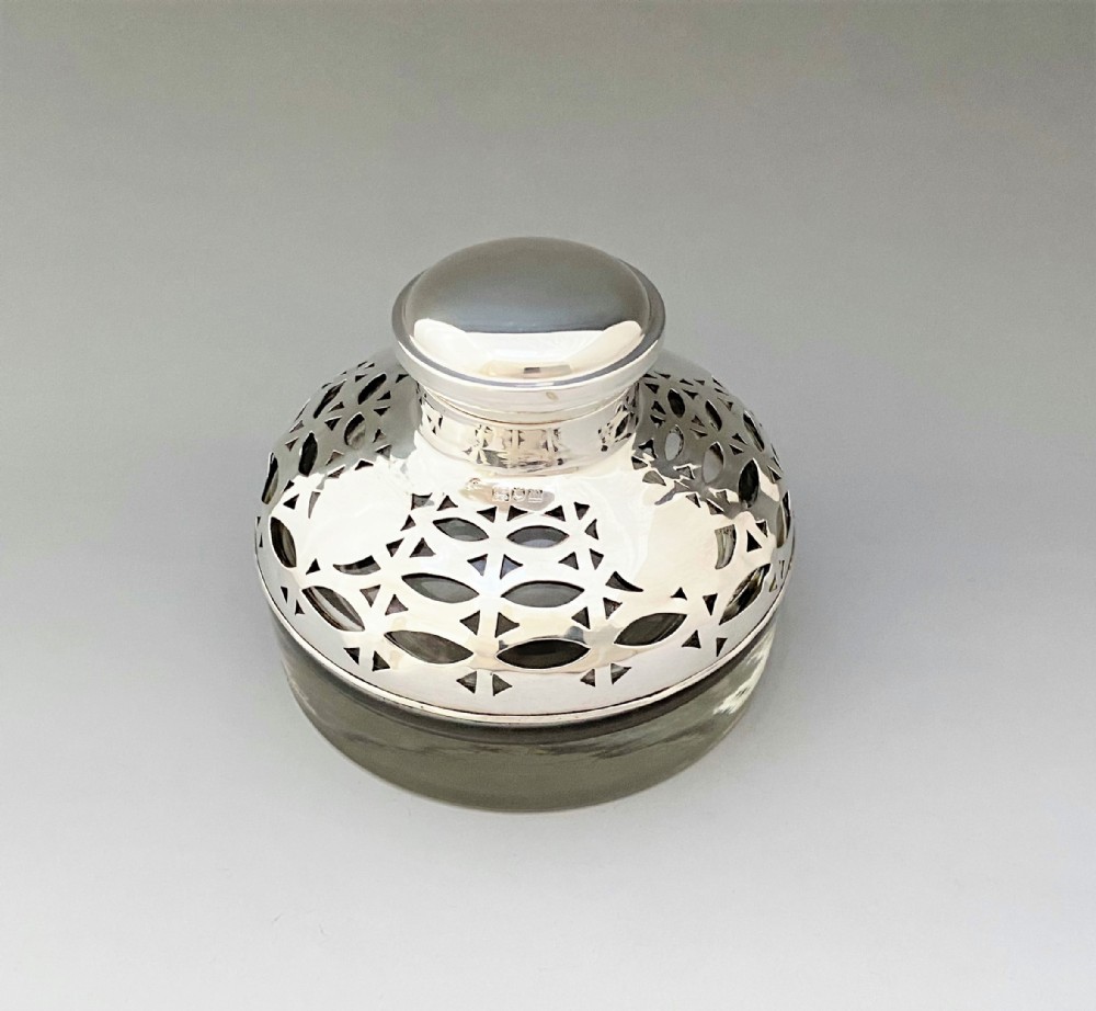 A gorgeous Edwardian pierced silver inkwell