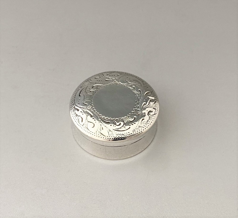A charming Victorian Bright Cut silver pill box