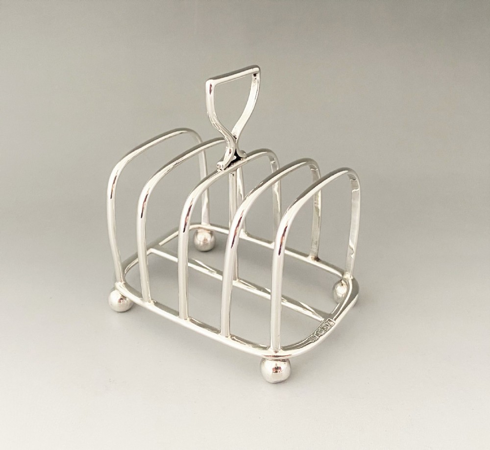 A Victorian four slice silver toast rack