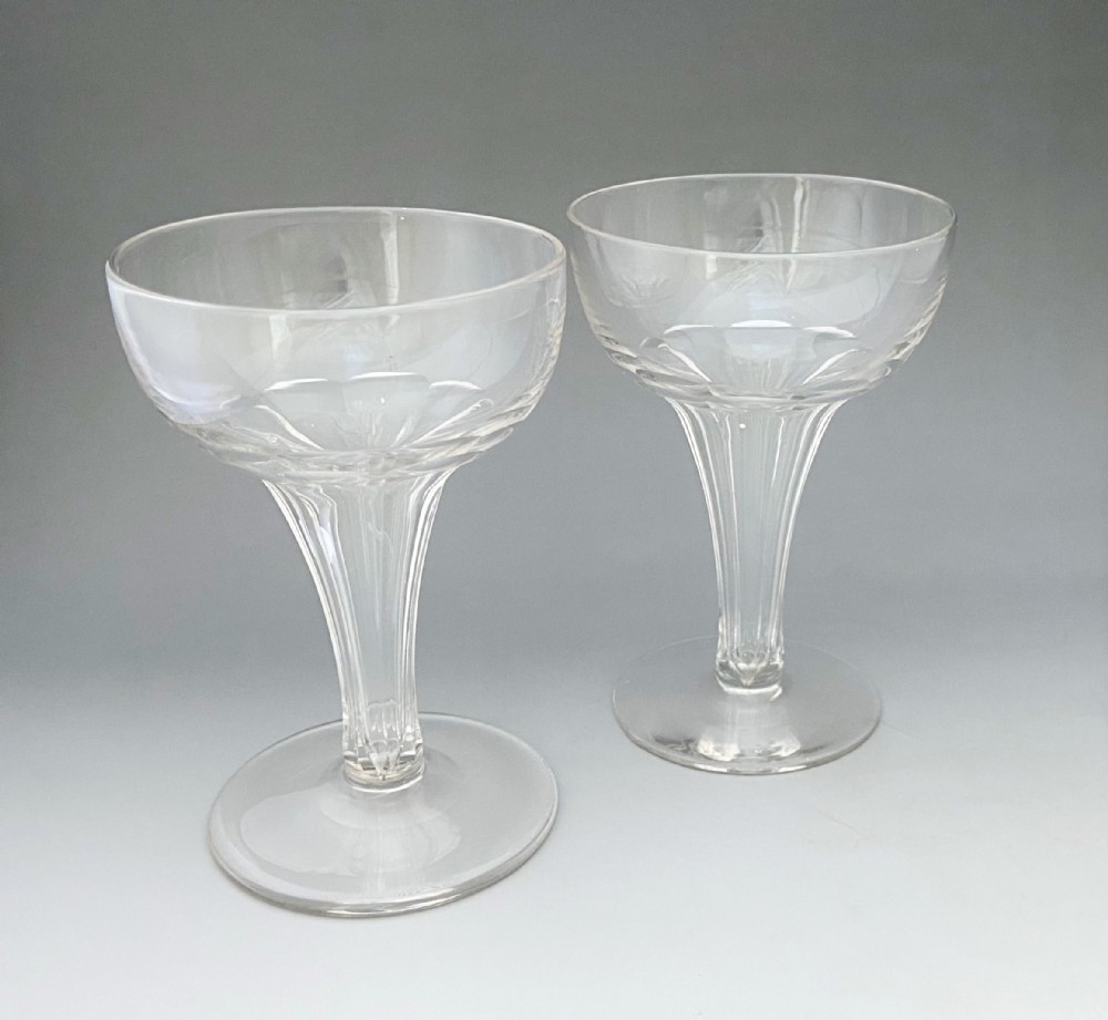 A pair of large hollow stem champagne glasses