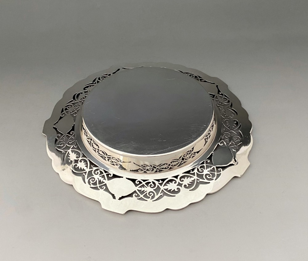 A superb Edwardian silver bottle/decanter coaster View III