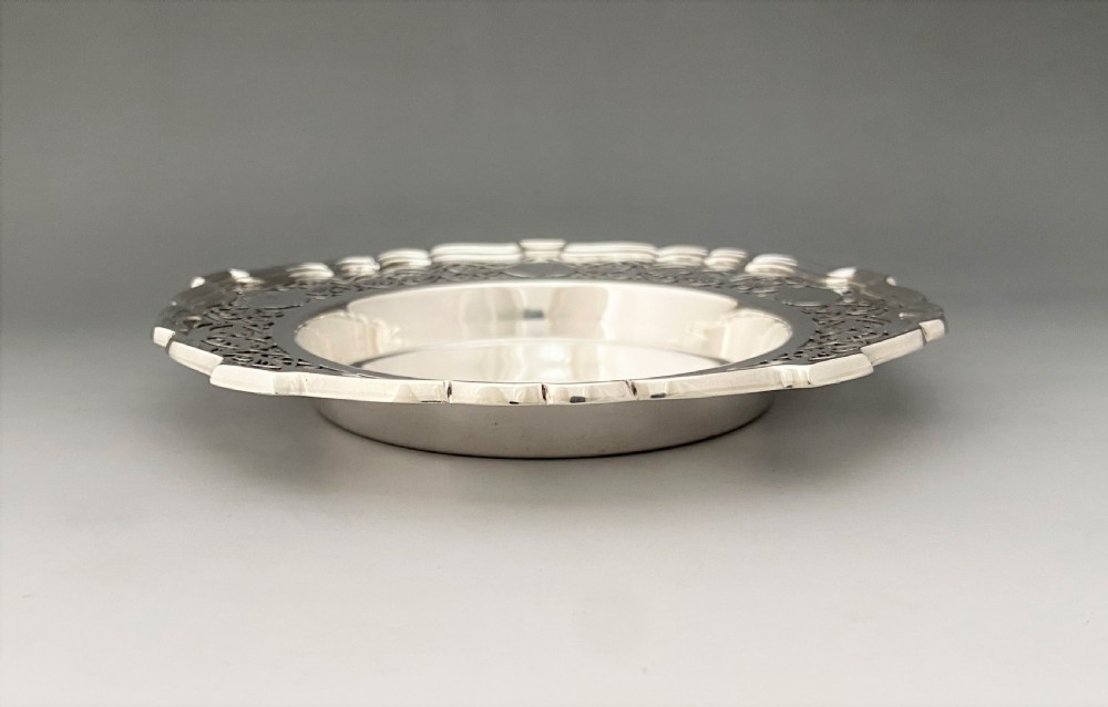 A superb Edwardian silver bottle/decanter coaster View V