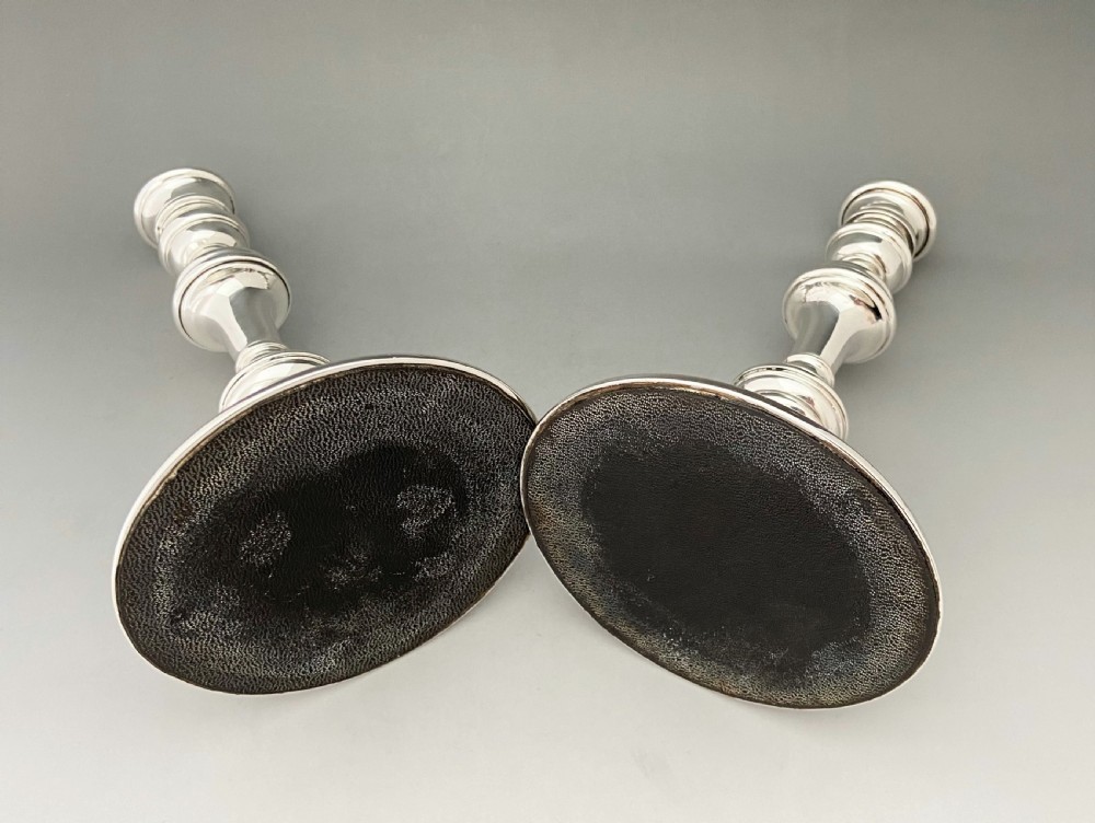 A handsome pair of George I style silver candlesticks View V