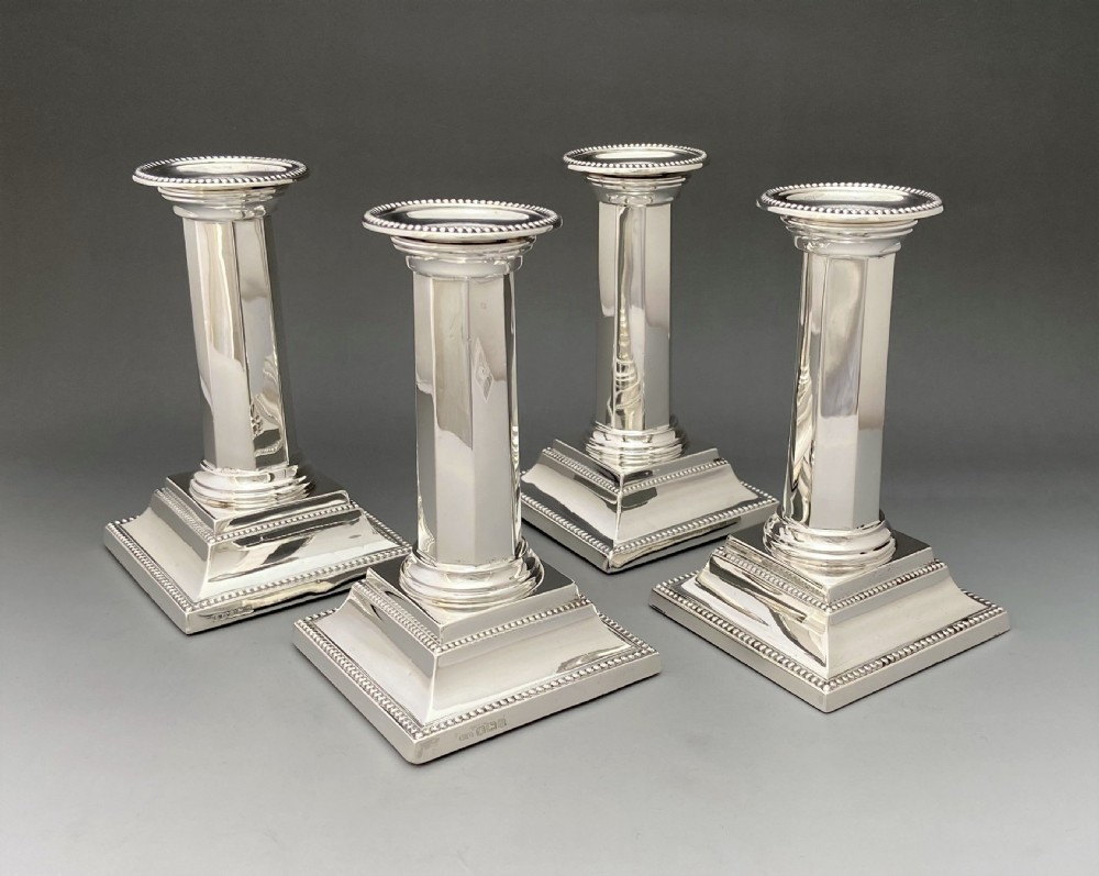 A rare set of four Art Deco silver candlesticks