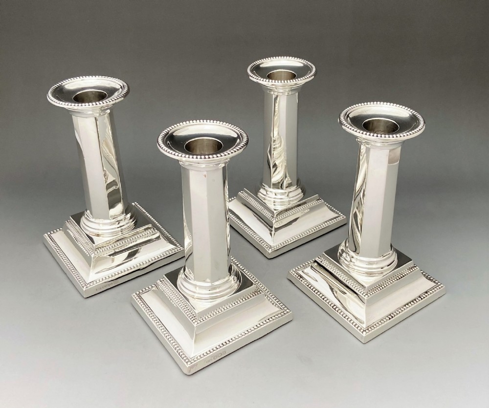A rare set of four Art Deco silver candlesticks View II