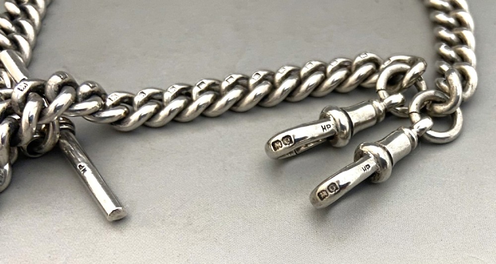 A wonderful George V silver Albert chain with silver fob View IV