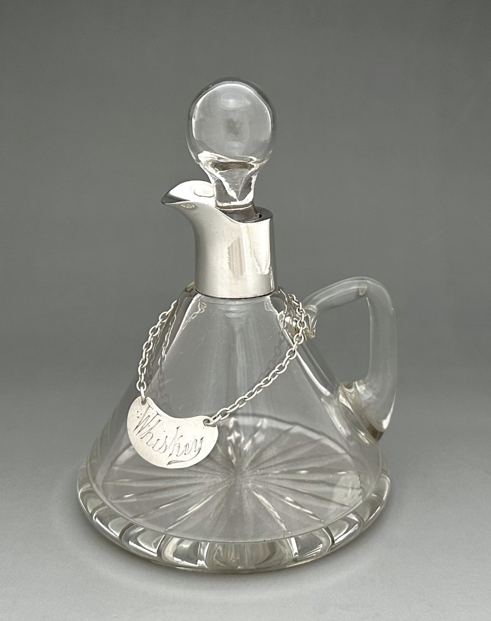 A superb silver mounted Whisky tot with silver label