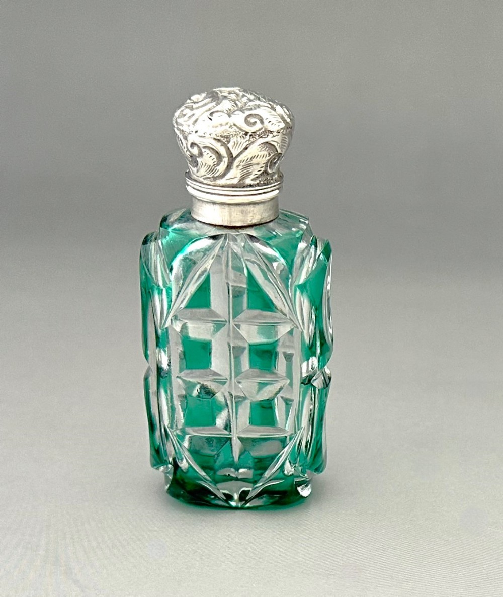 A gorgeous Victorian silver mounted overlay scent bottle