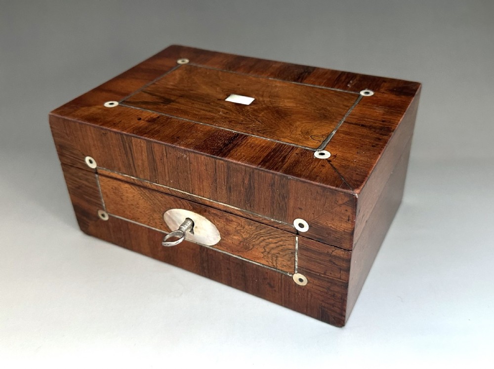 A gorgeous early Victorian rosewood sewing box