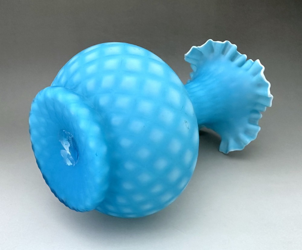 A light blue Victorian satin glass vase featuring a diamond air-trap pattern, a bulbous body, and a flared crimped rim with white cased glass detail. View III