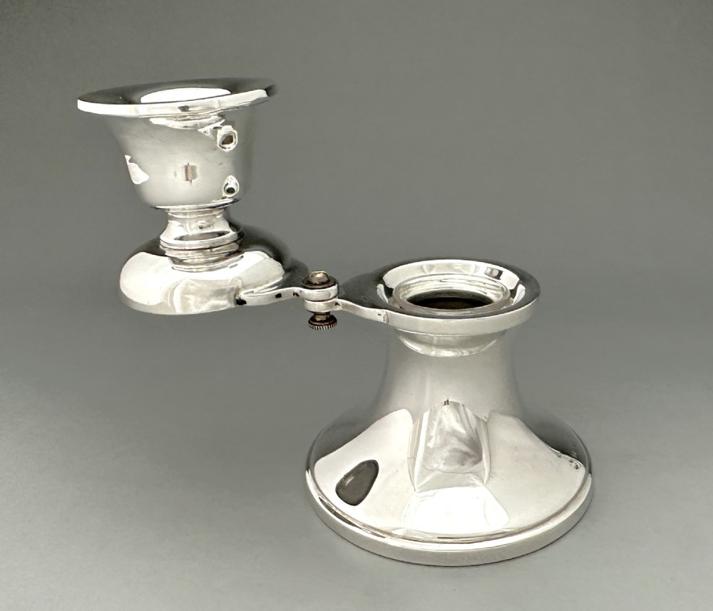 An unusual silver inkwell/ candle holder combo View VII