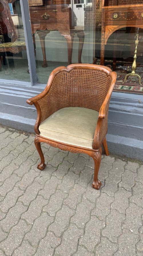 a walnut bergere armchair - CATEGORY: ANTIQUE CHAIRS - DATED 1920