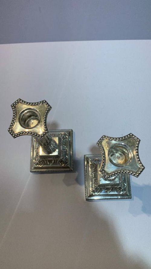 AN ANTIQUE PAIR OF SILVER CANDLESTICKS - ADDITIONAL PHOTO 1