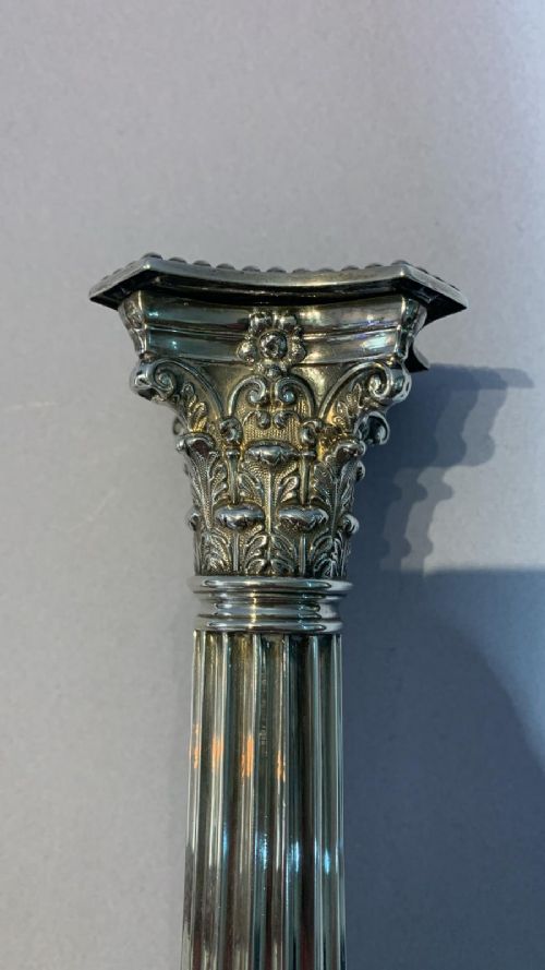 AN ANTIQUE PAIR OF SILVER CANDLESTICKS - ADDITIONAL PHOTO 3