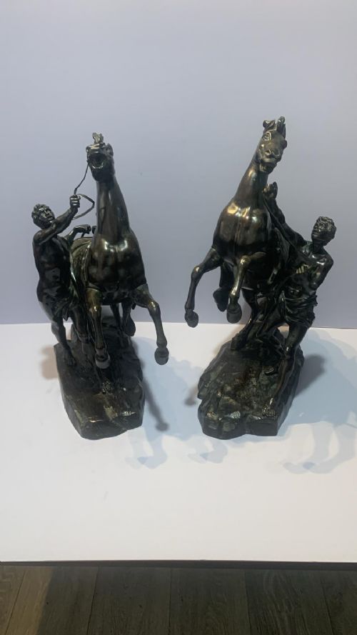 AN ANTIQUE PAIR OF BRONZE MARLEY HORSES