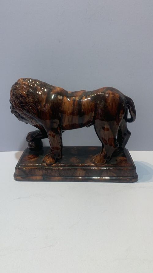 AN ANTUQUE TREACLE GLAZED LION - ADDITIONAL PHOTO 2