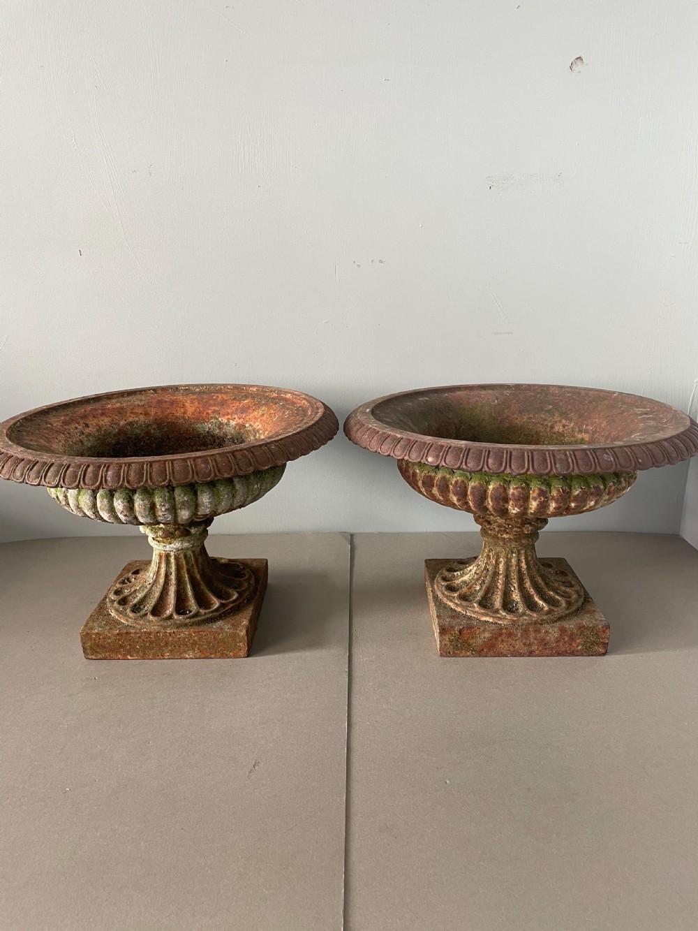 An Antique pair of 19thC cast iron urns View V