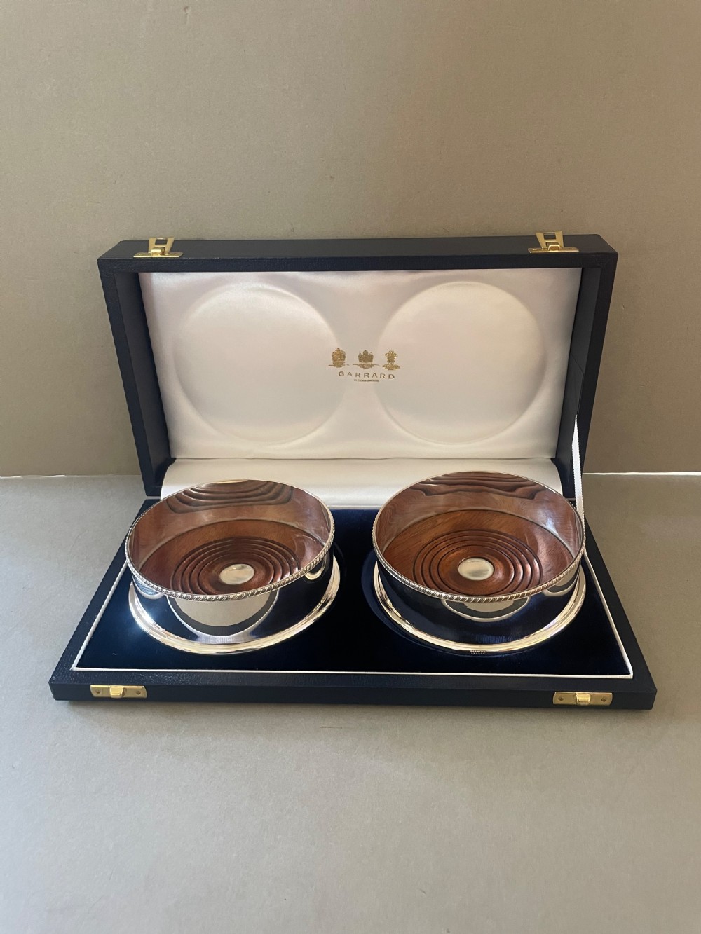 A Vintage Pair Of Garrard Silver Coasters
