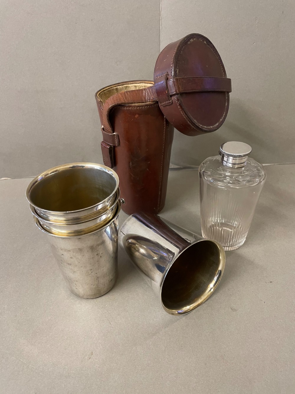 An Antique  hunting flask and four cups
