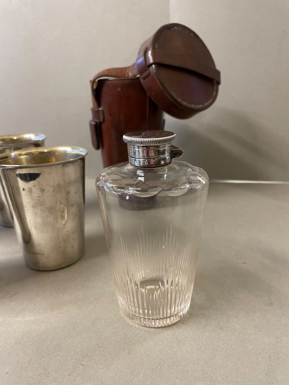 An Antique  hunting flask and four cups View II