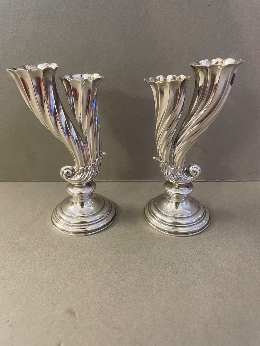 A 19thC pair of silver bud vases