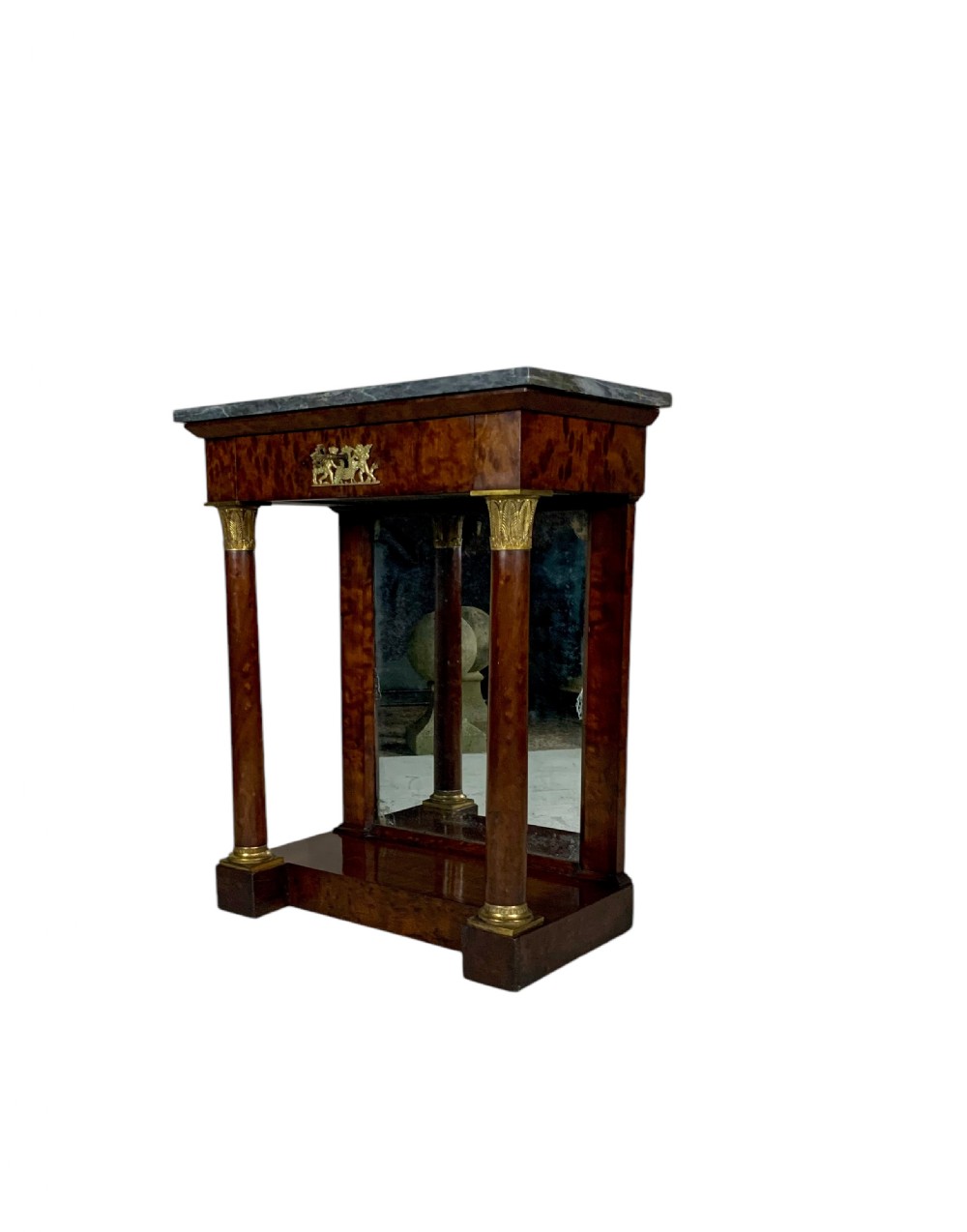 A French Empire mahogany console table featuring a grey marble top, gilt bronze column capitals, a central figural frieze mount, and a mirrored back plate. View III