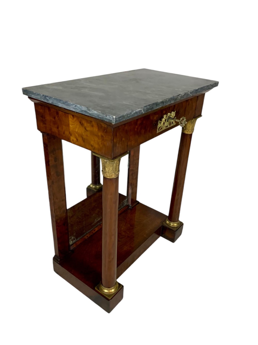 A French Empire mahogany console table featuring a grey marble top, gilt bronze column capitals, a central figural frieze mount, and a mirrored back plate. View XI