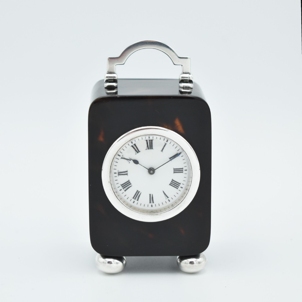 Small timepiece 'Tortioseshell style' Carriage clock.
