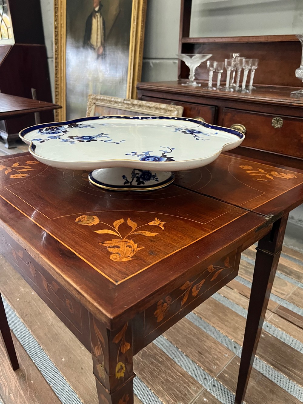 A Royal Worcester porcelain lazy susan featuring a scalloped rim with a cobalt blue and gilt border, decorated with blue floral chinoiserie motifs on a white ground. View II