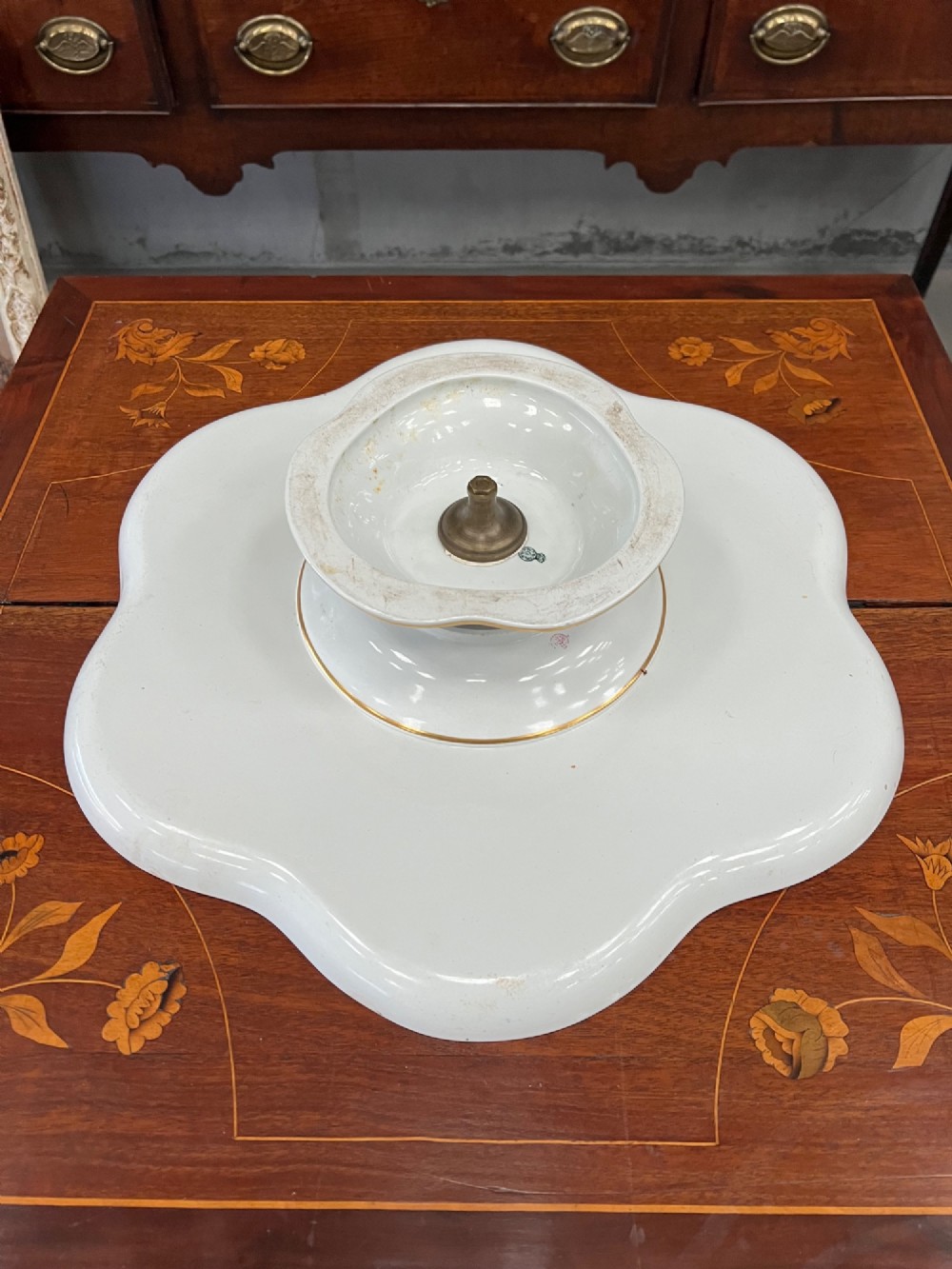A Royal Worcester porcelain lazy susan featuring a scalloped rim with a cobalt blue and gilt border, decorated with blue floral chinoiserie motifs on a white ground. View V