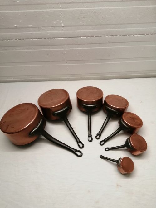 an antique set of french copper and steeliron pans - CATEGORY: ANTIQUE METAL - DATED 1920