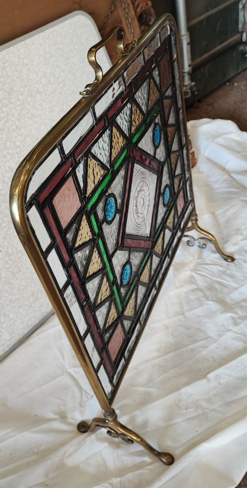 A VICTORIAN BRASS FRAMED STAINED GLASS FIRESCREEN - ADDITIONAL PHOTO 1