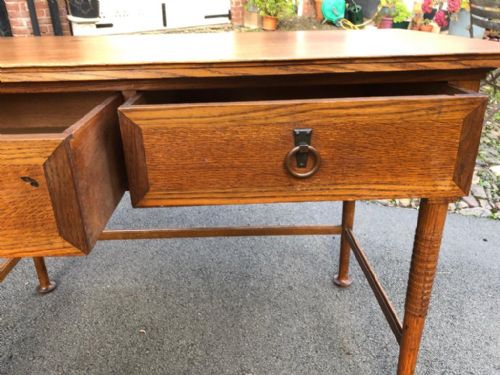 AN ARTS AND CRAFTS OAK 2 DRAWERS WRITING TABLE PROBABLY HEALS - ADDITIONAL PHOTO 1