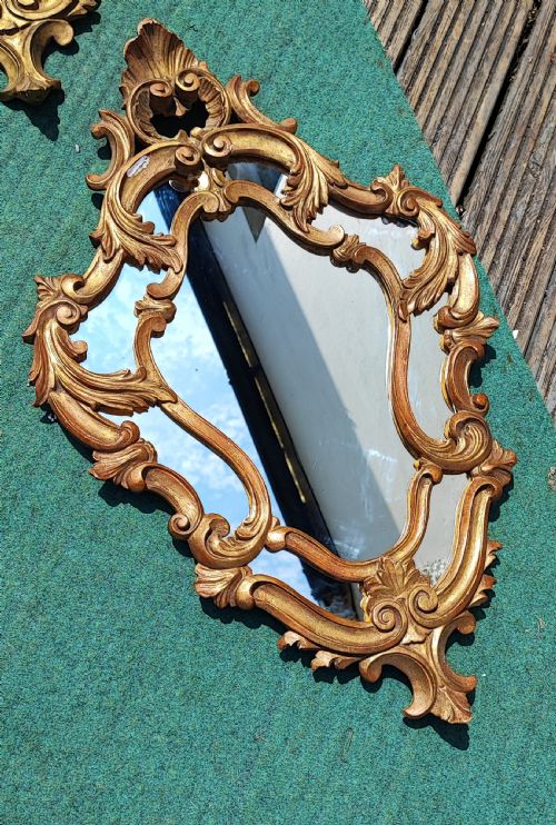 AN ANTIQUE PAIR OF CARVED ITALIAN GILTWOOD MIRRORS - ADDITIONAL PHOTO 2