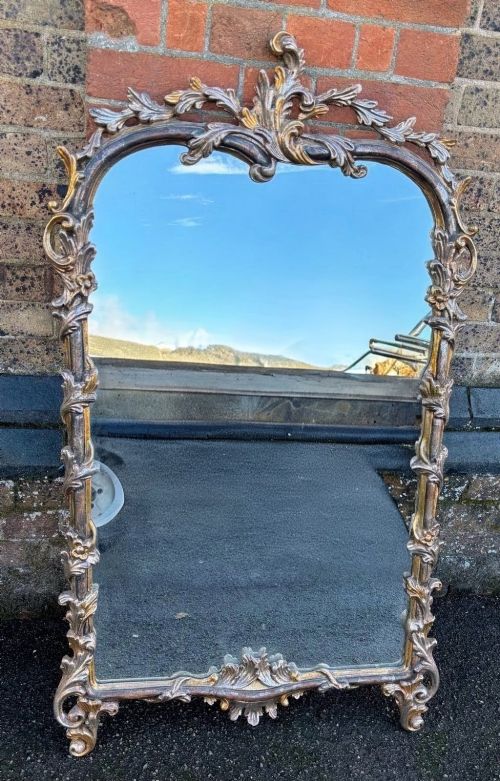 20th century Italian silvered and gilt large carved wall mirror