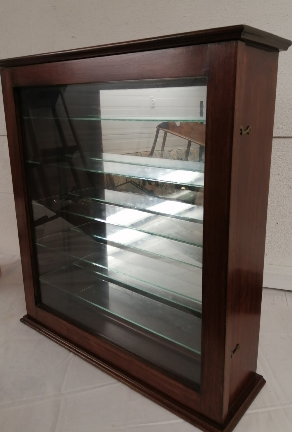 Mahogany mirrored wall cabinet.
