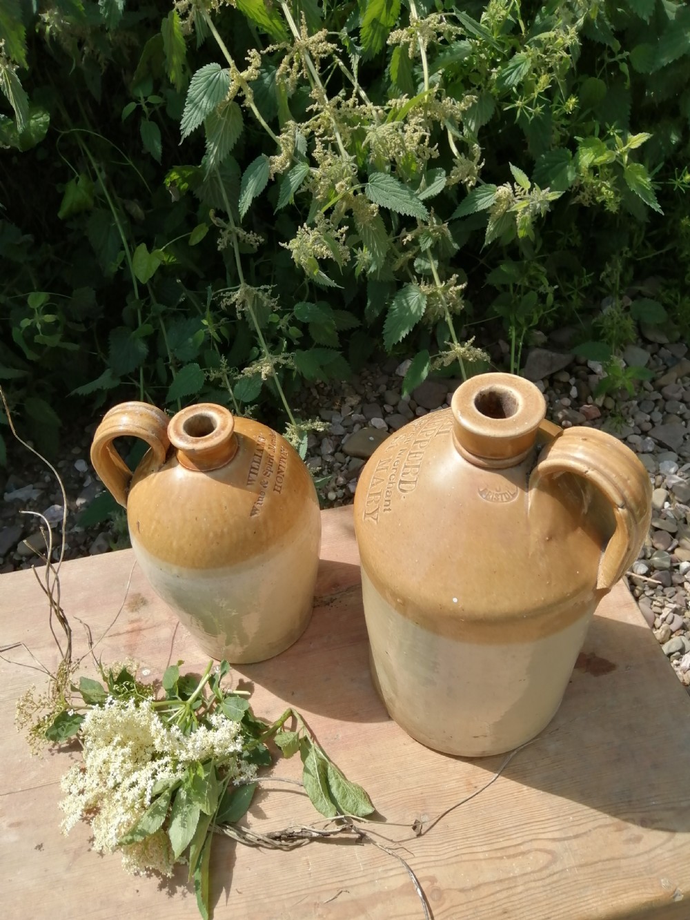 2 Devon stoneware Victorian wine or spirit jugs View V