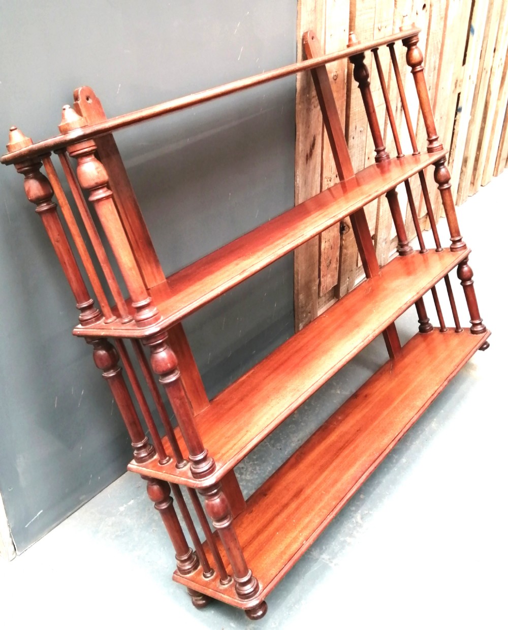 A fine country house regency hanging shelf 