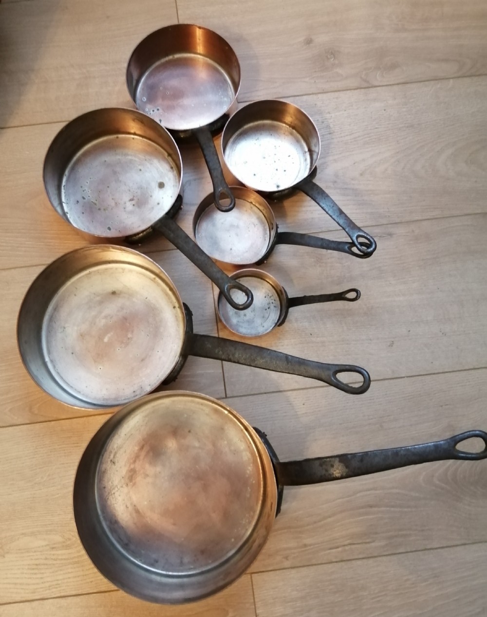 Antique set of 7 copper and steel French cooking pans. View III