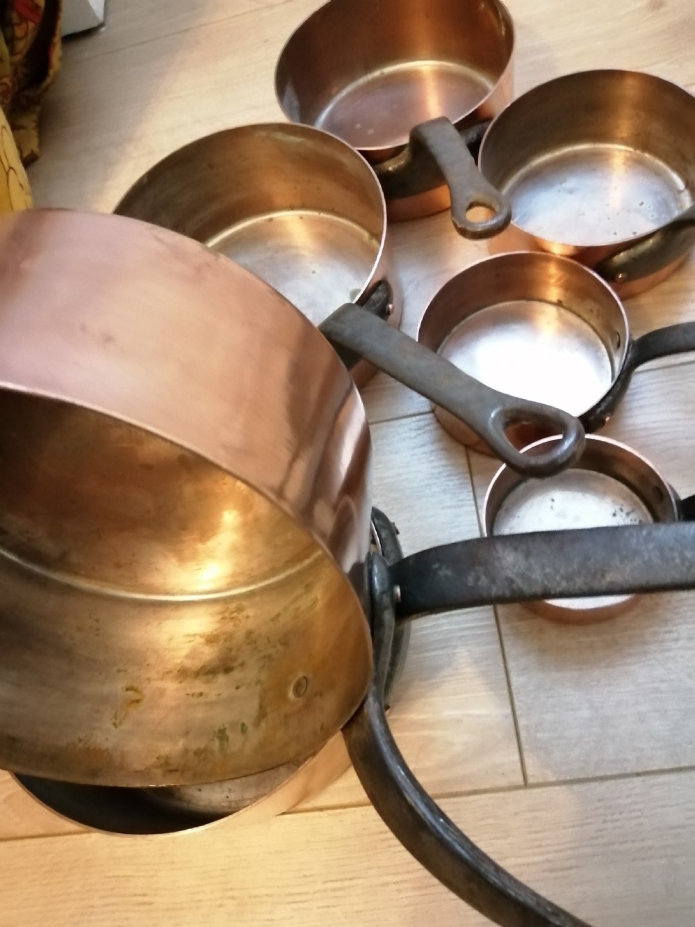 Antique set of 7 copper and steel French cooking pans. View IV