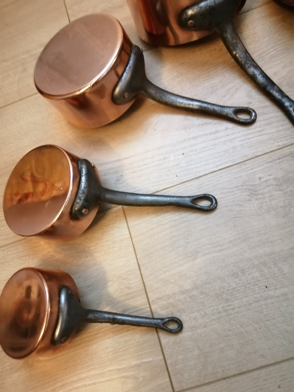 Antique set of 7 copper and steel French cooking pans. View VII
