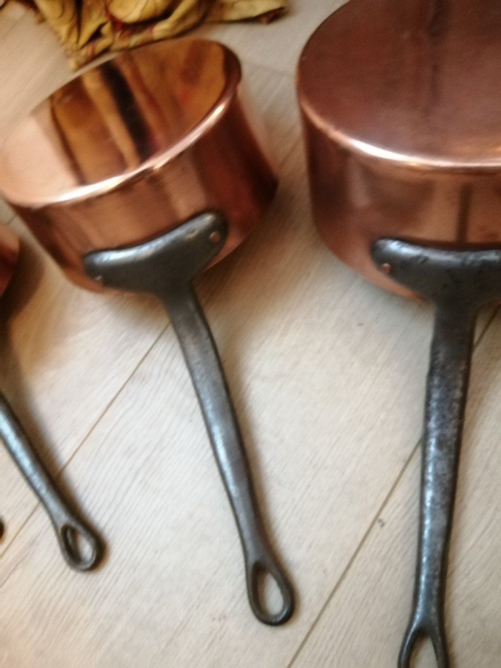 Antique set of 7 copper and steel French cooking pans. View VIII