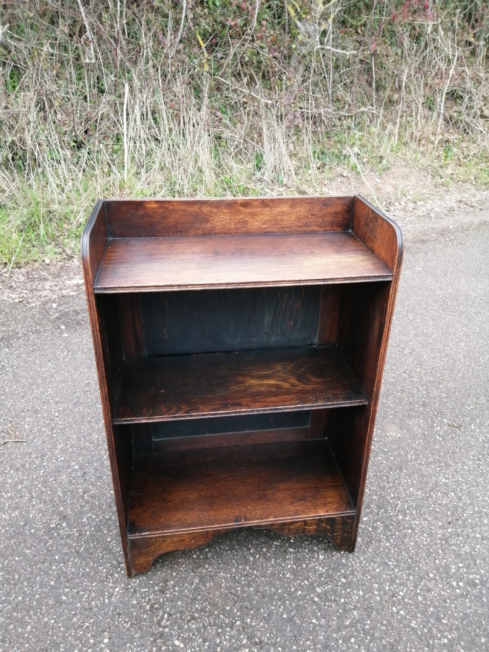 Small solid oak open bookcase.
