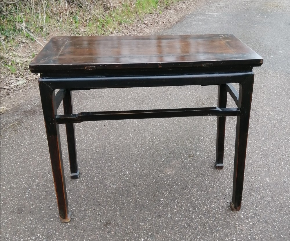 An antique oriental side hall table.