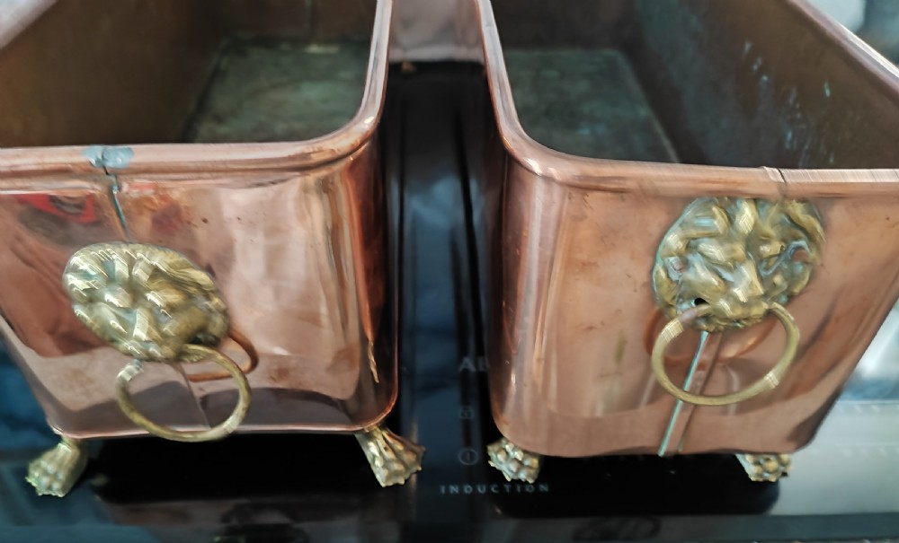 An antique pair of copper and brass planters. View II