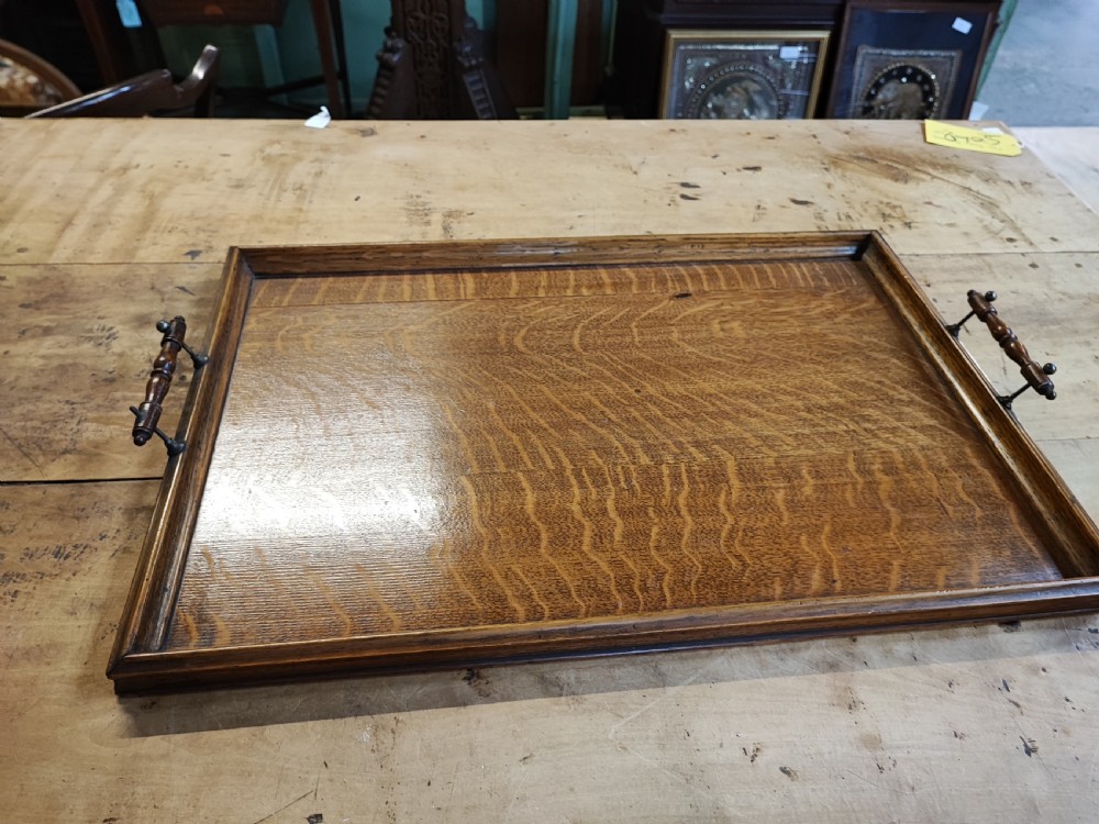 A large Edwardian oak and brass tray.