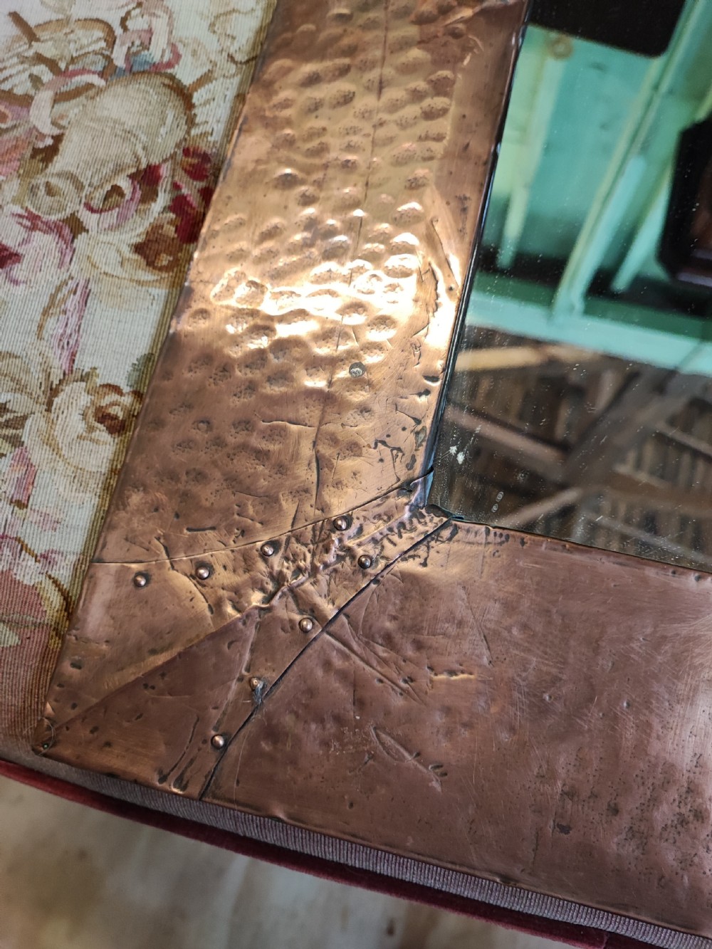 An antique art's and crafts Moto ( Behind Time) copper framed mirror. View III